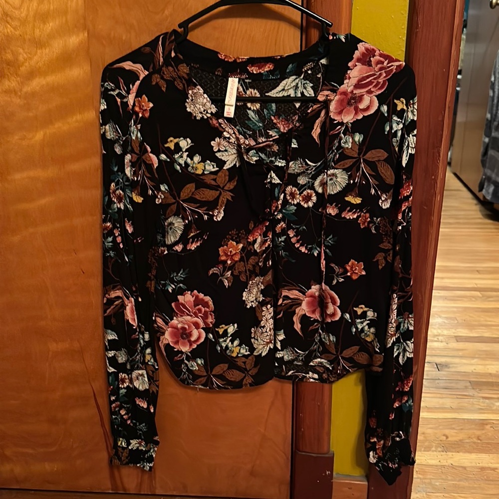 A flowy black floral blouse